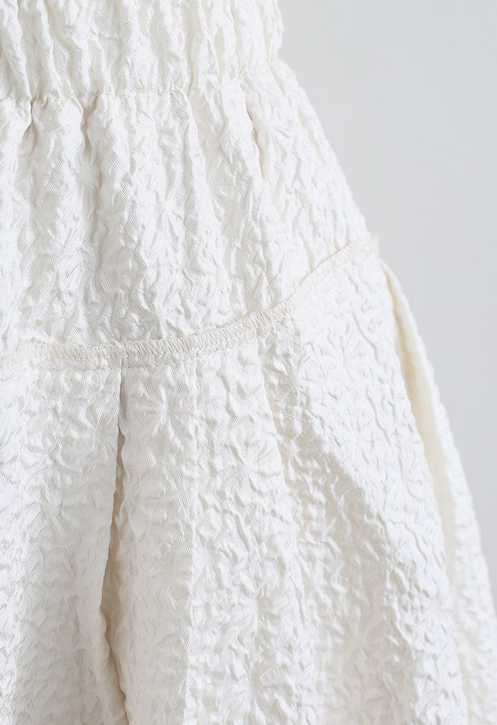 Side Pocket Pleated Embossed Midi Skirt in Cream