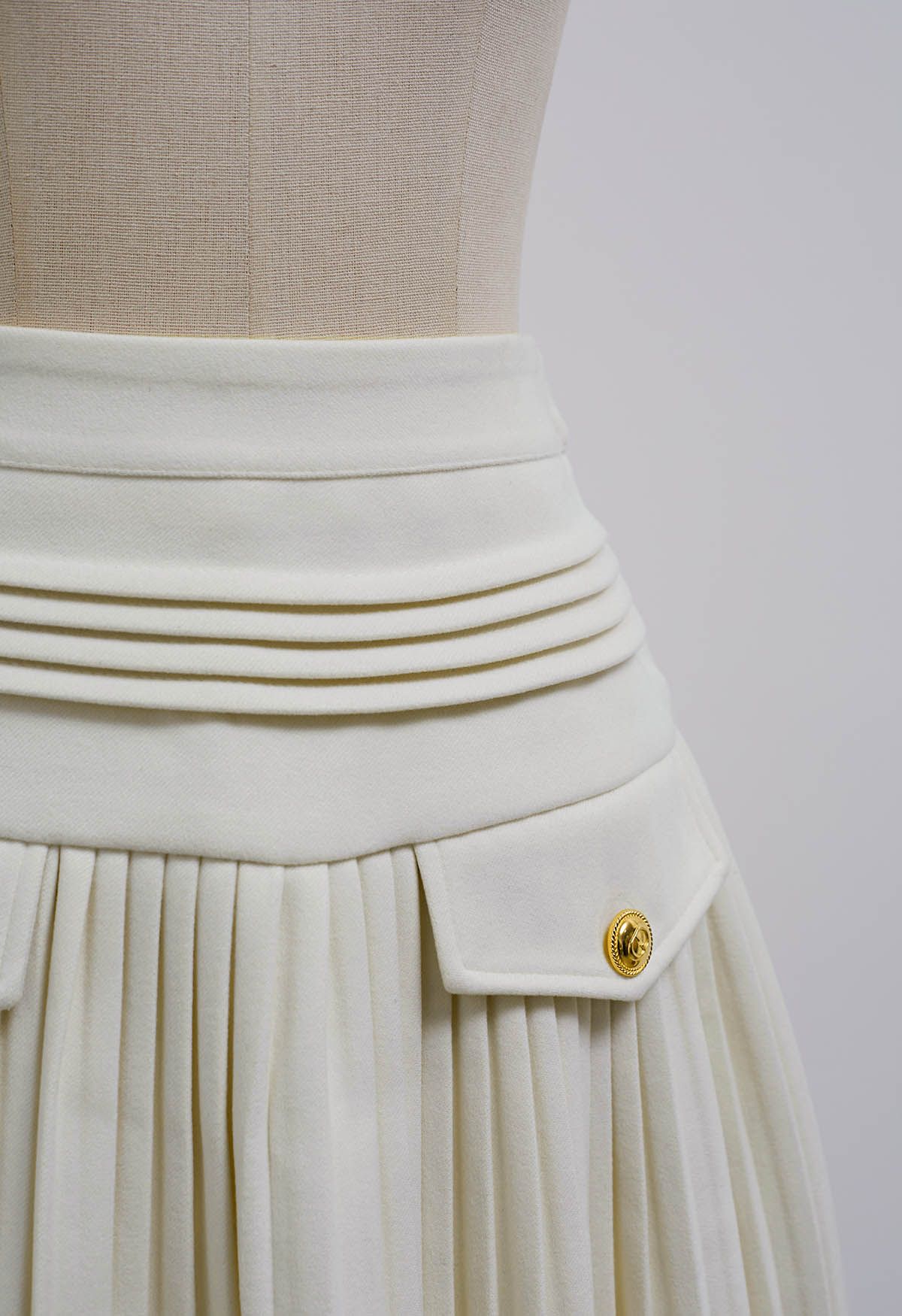 Golden Button Decorated Pleated Mini Skirt in Ivory