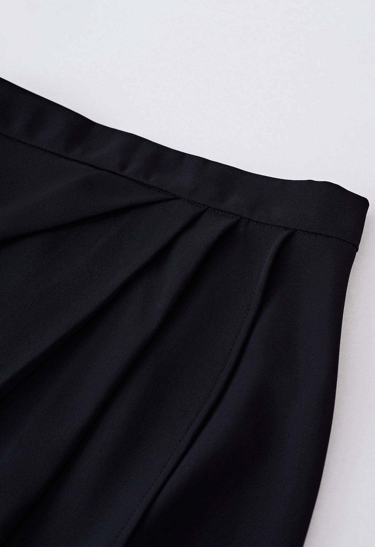 Side Pleated Flap Midi Skirt in Black