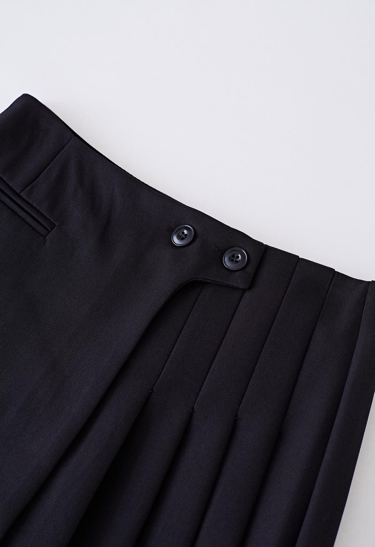 Twin Buttons Pleated Flap Mini Skirt in Black