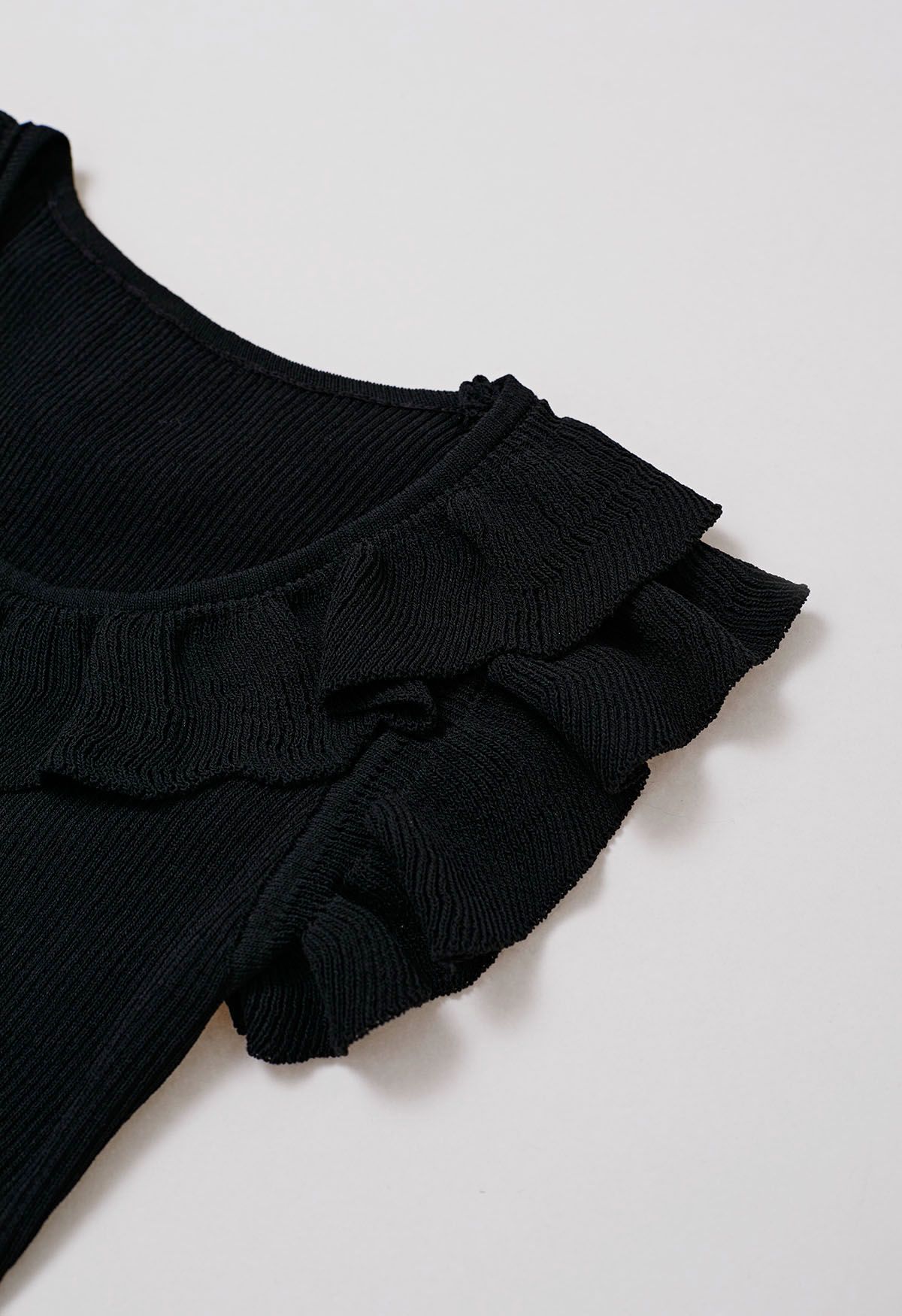 Ethereal Ruffle Sleeveless Knit Top in Black