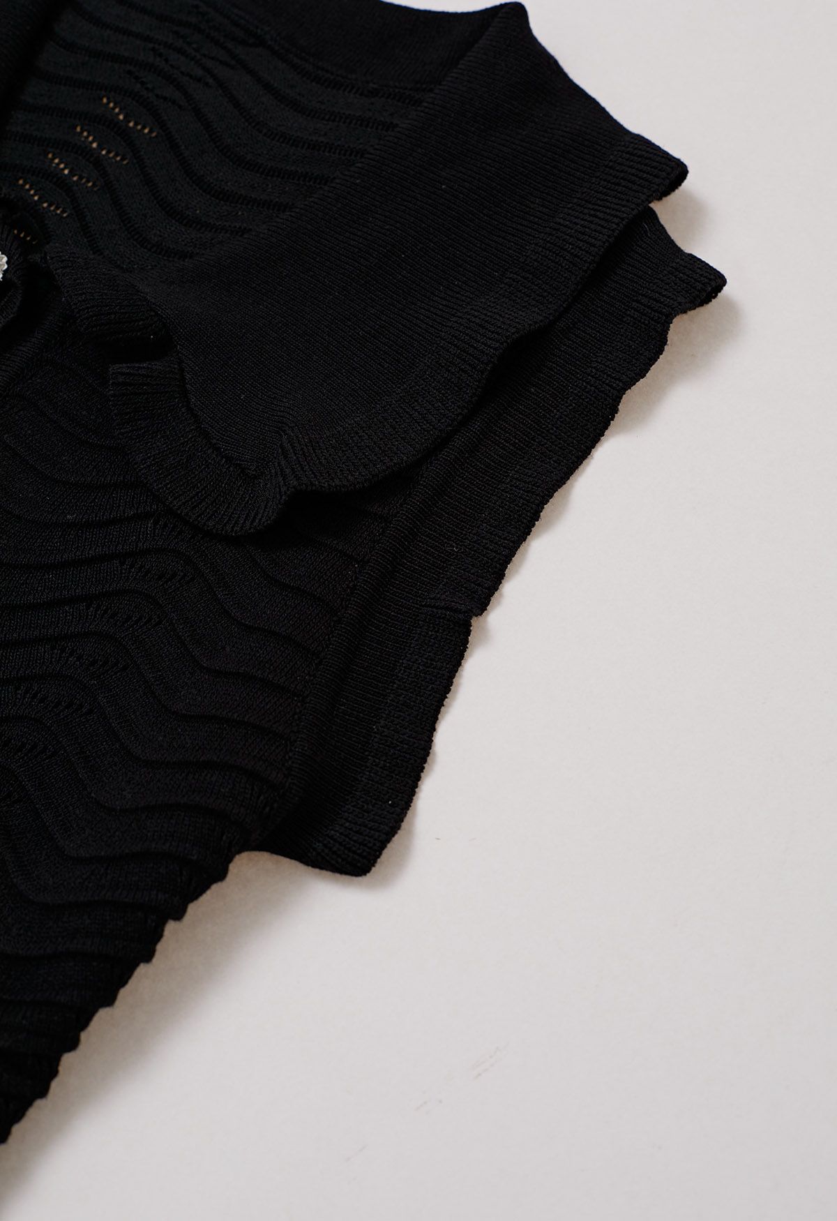 Ruffle Edge Wavy Pointelle Knit Top in Black