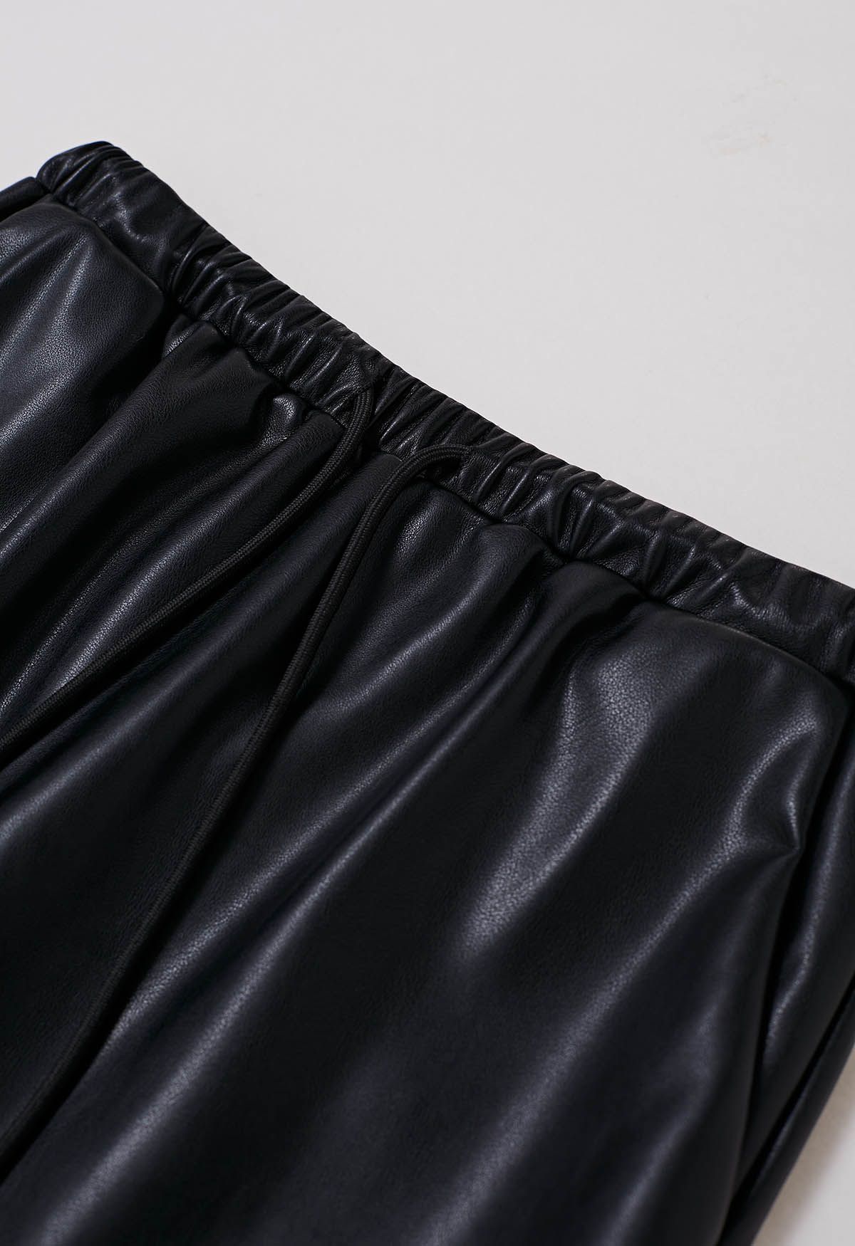 On-Duty Faux Leather Drawstring Shift Skirt in Black