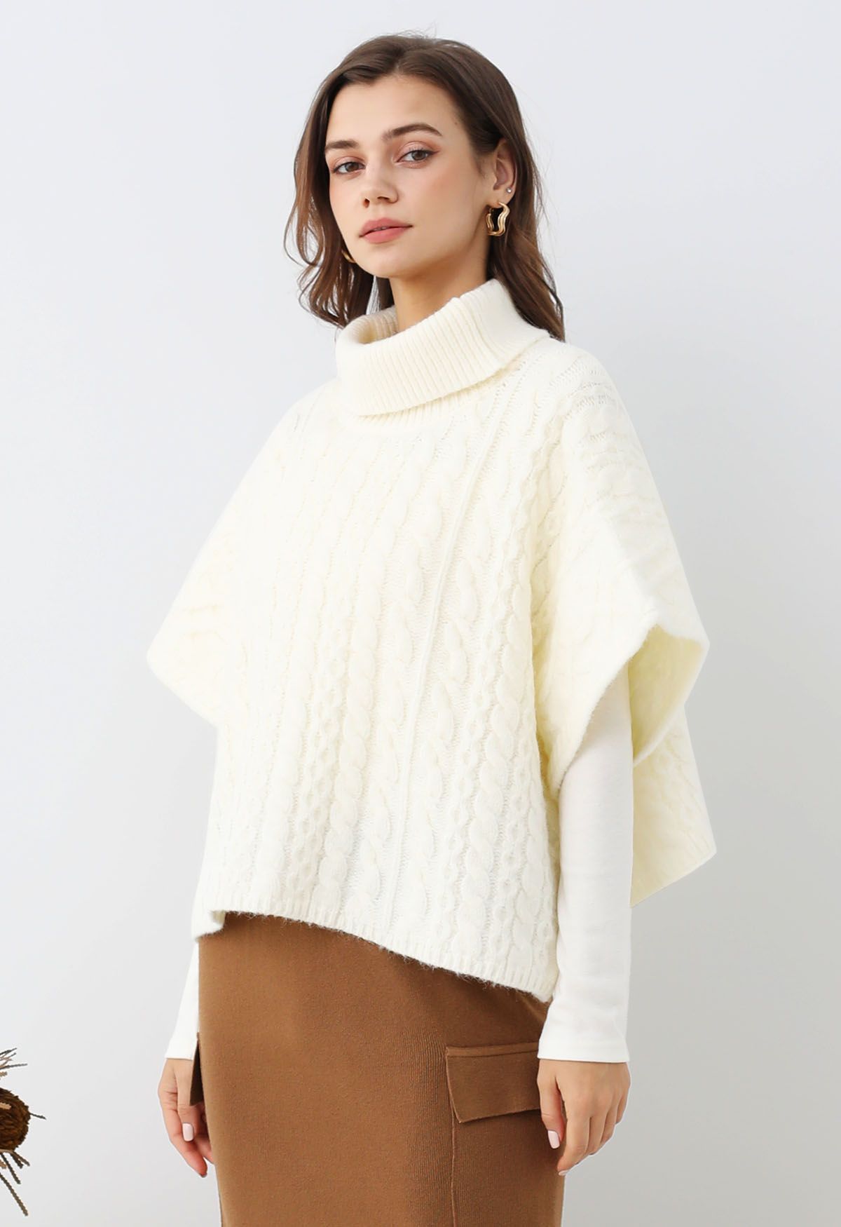 Warmth Turtleneck Cable Knit Cape Sweater in Ivory