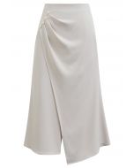 Pearl Side Pleats Asymmetric Flap Midi Skirt in Ivory